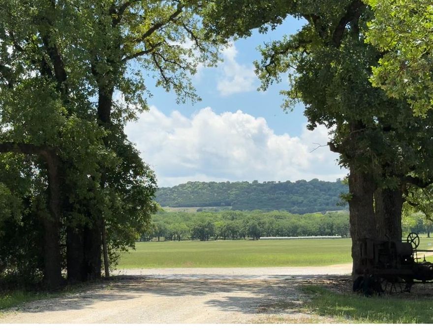 This is a private parcel setting at the base of Comanche Peak.  It is zoned agricultural use, outside the city limits.  No HOA.  This buildable site has incredible potential with the mountain views, seculuded, wooded, and cleared areas on this parcel.  A large tank enhances the beauty of this site.  The 3.2 acre lake has blue heron, geese, ducks, red birds, fish, and lots of wildlife.  There is a natural gas pad approximately 2 acres.  A pipeline runs along the road to the pad.  Please call the agent for details on the gas pad.  Restriction is no mobile homes. You may subdivide.  Also please see MLS listing 20935789 27.93 acres which borders this parcel.