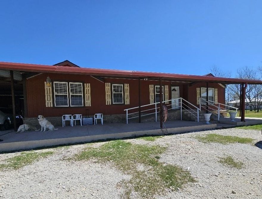 Little Bit of Country with all you need to start your farm. Bring your horses, goats and chickens, the barn is ready! Come see this Doublewide with 3 bedrooms, and 2 bathrooms, with native Bermuda-Coastal pastures. This is a rare find with all you would want on a mini farm.  Sits on 5.6 acres of land, fenced, carport, and storage Conex container, as well as nice front and back porch with ramp.  Remote gate opener on the entrance! Don't miss out on this great opportunity to own a slice of country living just minutes from town!!