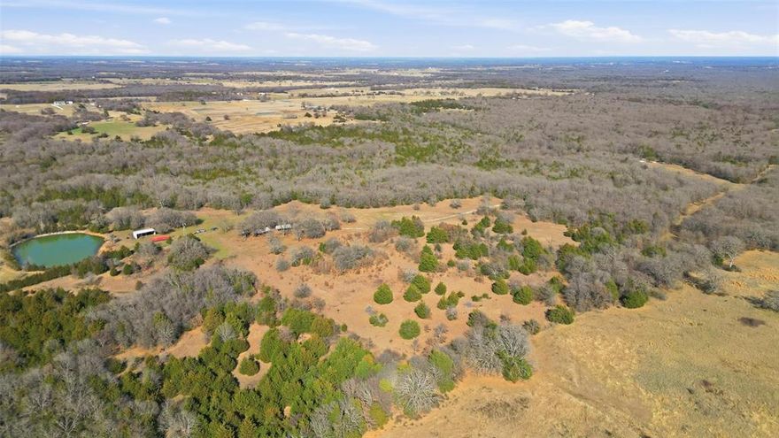Discover the beauty and freedom of North Texas country living on this stunning 152.519-acre tract northwest of Whitesboro. With an agricultural exemption already in place, this remarkable property offers the perfect blend of rolling hills, mature woods, open pasture, a creek, two ponds, and abundant wildlife, creating a setting that is both scenic and full of opportunity. Fully fenced and rich with character, the land is ready for your vision with valuable improvements already in place, including two covered RV structures with electric, water, and septic hookups, a barn, a windmill, and a water meter installed at the road. With approximately 2,860 feet of road frontage and multiple ideal build sites, this property is a true blank canvas for a dream ranch, private retreat, recreational getaway, or hunting property. Conveniently located just about an hour from the intersection of Highway 380 and the Dallas North Tollway with the continued expansion north to Tioga, this is a rare chance to own a peaceful escape from the city without giving up accessibility. Come walk the land and experience everything this exceptional property has to offer before it is gone.