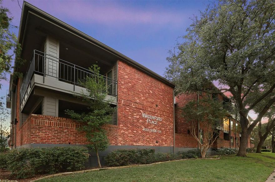 Fabulous one bedroom and den with spacious layout in spectacular location just south of Lovers Lane and east of the Tollway. Kitchen features granite countertops, custom tiled backsplash, and STAINLESS STEEL (not white as pictured) appliances.  Bathroom was just remodeled (2023) with quartz counters, new bathtub and tiled surround. Vinyl plank wood flooring in living areas and den. Beautiful tiled wood burning fireplace. Large living room with wood burning fireplace and access to private balcony.  Underground gated parking and elevator in the building. Full size washer and dryer are included.  Professionally managed and maintained. Highland Park Schools.  Photos of of a similar apartment home.