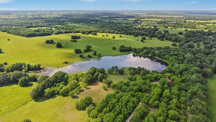 Lone Star Lake at Pecan Ridge Ranch – A Rare 47-Acre Estate Sale  
Discover a once-in-a-lifetime opportunity with this first-ever-offered estate at Lone Star Lake at Pecan Ridge Ranch, nestled at the end of Fogleman Rd near the Cedar Creek Lake community in Kemp, TX 75143. Spanning 47 acres, this one-of-a-kind property boasts a serene private interior lake, a thriving pecan orchard, and a custom-built  mountain-style home designed to capture stunning lake views.  
The 3-bedroom, 3-bathroom residence features timeless architecture with a striking stone fireplace as the centerpiece of its cozy, rustic charm. With a 2+ car garage and beautifully landscaped grounds, the home offers ample space and potential for future enhancements. Bordering a neighboring cattle ranch, this estate provides a true sense of rural tranquility—perfect for those seeking a property that feels a million miles away from the hustle and bustle of Dallas, yet is just 44 miles away, a drive of approximately 46 minutes.  Virtual Drone Tour Uploaded to Virtual Tour Link in MLS
Ideal for those seeking a legacy property or a peaceful retreat, this estate is a rare gem waiting for its next chapter. Don’t miss your chance to own a piece of Texas paradise—schedule your private tour today!