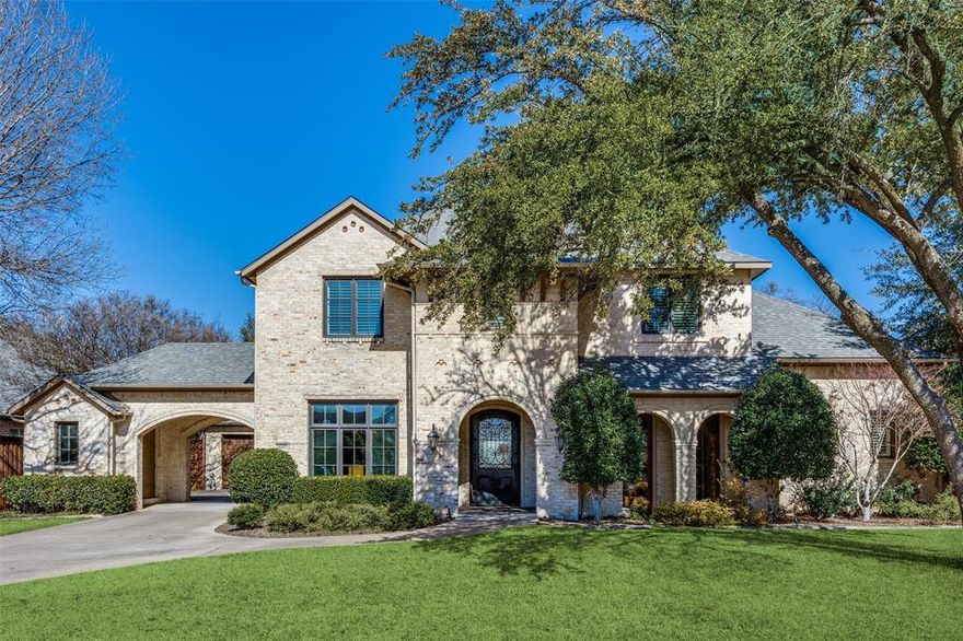 Enjoy quiet luxury and convenient access to elite schools, upscale shopping and dining at this  spacious 4,100 square-foot, 5-bedroom, 3.5-bath home on a 0.36-acre lot in prestigious Preston Hollow. 
This beautifully designed custom home by renowned Dallas builder Registry Homes blends clean traditional architectural lines with modern rustic elegance. 
The first floor features the primary suite with a vaulted ceiling and hand-decorated beams by an École du Louvre French artist laureate. The primary bath includes a jetted soaking tub, dual shower, separate vanities, and two walk-in closets.
The  living room has a beamed decorated ceiling that flows seamlessly into an elegant,  large open kitchen. A  formal dining room  comfortably seating ten, an office, and a powder room are also located on the main floor. 
Upstairs, four bedrooms and two full bathrooms offer flexible options, including space for a media room, fitness area, or bonus room.
Step outside to the backyard featuring a covered outdoor living area that includes fireplace, dining space, and outdoor TV. Added in 2022, a large heated pool with a raised stone circular spa, a putting green and manicured low maintenance landscaping bring the final touch to this beautiful outdoor retreat.
An oversized two-car garage with built in cabinetry  and a detached storage room complete the home. 
This residence truly embodies the best of Preston Hollow living.
Buyer and buyer’s agent to verify all information herein, including room measurements, schools, taxes, HOA, easements, and restrictions.