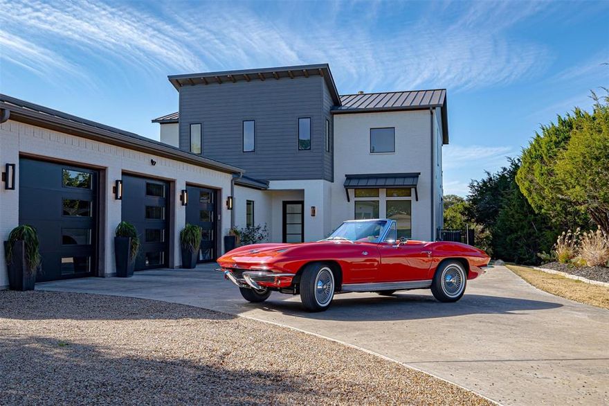 A Masterclass in contemporary design! This 2018 build was a custom collaboration carefully envisioned between Will Steed Custom homes, La Belle Maison interior Inc and owners who are lifelong lake residents all culminating in a home that focuses on ease of use, and a waterfront lifestyle. Attention to bring a connection with nature is evident as expansive balconies and  large picture windows bring you closer to the peace of the outdoors. This unique floor plan  allows for the very best views of Lake Granbury to be seen from the kitchen, living Room and primary bedroom as they are on the second floor and are all serviced by a convenient elevator. The Kitchen is impressively dressed in quality wood cabinetry with a modern design, Kitchenaid appliances that include an icemaker, wine fridge and built-in side by side refrigerator. The primary Bedroom features an electric fireplace and ample space for a seating area to enjoy the view. The Primary ensuite has its own washing machines, and is equipped with a generous sized shower with rain head and a large tub. Downstairs you will find a sunlit foyer with views out on to the pool area that can be seen from the entrance way. A large office and secondary bedrooms that share a jack and jill bath as well as an impressive guest bath adorn the first floor. This home is foam insulated, pre-wired for a Generac Home generator, and features a whole home water softener and filter. Outside you will find an outdoor kitchen with Large grill, crawfish boiling station, and flat skillet. Swimming pool features a swim up bar, sun pad as well as a heater for the pool and attached hot tub. Home is wired for smart home automation with use of your alexa system along with a commercial grade wifi system. Boat dock is equipped with a 24 foot slip and double jet ski lifts.