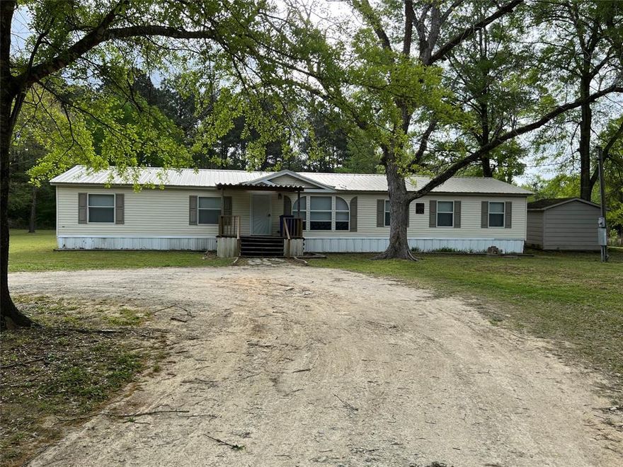 Cozy With A Country Feel~ This Charming 4 Bedroom 2 Bathroom Manufactured Home Is Located On A Corner Lot With Over 1.4 Acres ~ NEW HVAC ~ Patio, Roof , and Sump Pump is 3 years Old~It is a must see!! SCHEDULE YOU APPOINTMENT TODAY!!