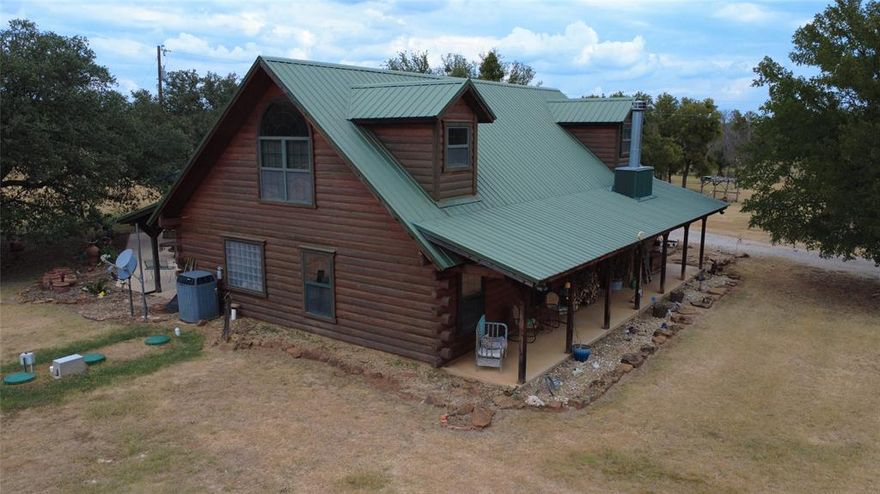 Charming Ranch Property with Custom Log Home & Scenic Land

Now available is this beautifully crafted 2-bedroom, 2.5-bath, two-story log home with rustic charm and modern comfort. Featuring tile floors throughout and stunning wood stairs, this home offers a warm, inviting atmosphere. The upstairs game room offers flexible space and could easily be converted into a third bedroom to suit your needs.

The unique stones used in the homes interior were sourced directly from the property, adding character and a sense of place. In addition to the main house, there is a cozy ‘lady cabin’ complete with a wood-burning stove, ideal for relaxing, or could be a guest room or extra living space.

The ranch also includes a large barn with a slab floor, perfect for use as a workshop or additional storage. Two covered awnings provide sheltered parking for your RV, tractor, or equipment.

The land itself is breathtaking, with a mix of oak, elm, and mesquite trees, two stock ponds, and abundant wildlife. The area is known for excellent deer hunting, making it a great option for outdoor enthusiasts.

Located near Lake Brownwood, this property offers the perfect blend of peaceful country living and convenient recreational opportunities. Whether you’re looking for a Country Home on acreage, or a weekend retreat, this ranch has it all.