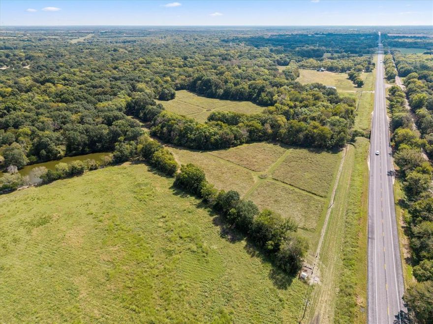 This 35+- Acre property has about 600 ft of main highway road frontage and is currently in Wildlife Agricultural exemption. The Hickory and Cowleech Fork Creek runs along as the border adding beauty and as a water resource for the wildlife. Most of the land lies within the floodplain, making it best suited for recreational! Abundance of wildlife to enjoy! There is approximately 2 acres located by highway showing out of floodplain. All utilities are at the road but you will need meters. The front is gated with a barb wire fence along road and the other border is tree lined! This property is heavily treed with Oak, Cedar and some Pecan! Border lines are approximate!