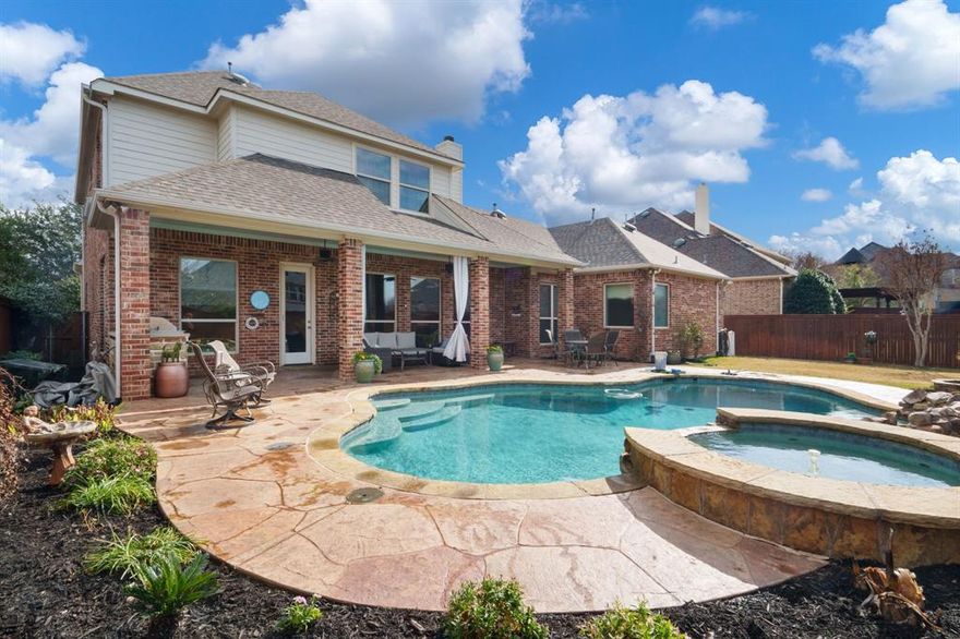 Nestled in the desirable Lantana community, this semi-custom home offers timeless curb appeal with its striking brick-and-stone exterior, beautifully manicured landscaping, and spacious three-car garage.
Designed with both functionality and flexibility in mind, this spacious home offers five bedrooms, providing plenty of room for family and guests. A perfect set up with three bedroom & two baths on the second floor. A dedicated media room creates the ideal space for movie nights, while a game room offers additional room for recreation and gathering.
Step inside to discover open, inviting living spaces enhanced by scraped wood floors and elegant arched doorways that add architectural charm and character. The heart of the home is the open kitchen, which flows seamlessly into the family room featuring a cozy fireplace. A formal dining room provides the perfect setting for special gatherings and holiday celebrations.
The private home office is a true showpiece, complete with custom wood built-in shelving and a stunning wood-paneled ceiling.
Outdoors, escape to your own backyard oasis featuring a sparkling pool, expansive patio, and built-in grill perfectly designed for entertaining or relaxing evenings at home.
Blending quality craftsmanship, thoughtful design, and seamless indoor-outdoor living, this exceptional home offers comfort, elegance, and timeless appeal in one of Lantana’s most sought-after neighborhoods.