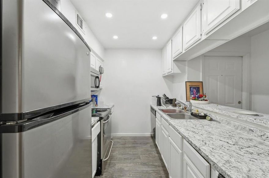 Location, location, rare in this complex 3 bed, 2 bath condo with views of tennis courts and pool. Lots of natural light. Corner fireplace in the living room is great for cooler weather and cozy ambience.  Covered balconies off the living room and master bedroom. Gated community with keypad entry. Elevators in the building's common area for easy access, but also has stairs for those who want burn extra calories.  The following are included in the HOA fees; Sewer, Water and full use of facilities, maintenance structure, management fees.