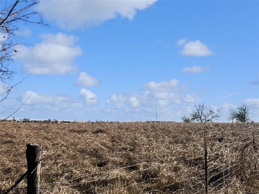 Beautiful 0.6-acre lot offering wide-open views and a peaceful rural setting. The property is fully enclosed with chain-link fencing, providing security and clear boundaries. Water and electricity are available at the road, making this a great opportunity for future building or adding a barn, workshop, or additional space.

The lot currently does not have a culvert or driveway access from the county road, giving a buyer flexibility to design their own entry.

An added bonus: this parcel adjoins a charming 2-bedroom, 1-bath home on approximately 1 acre that is also available for purchase, offering the potential to own over 1.5 acres combined for expanded living space, gardening, animals, or additional structures.

Enjoy peaceful country views and open skies while still being within easy reach of nearby towns and amenities. Adjoining property also for sale: MLS 21150875