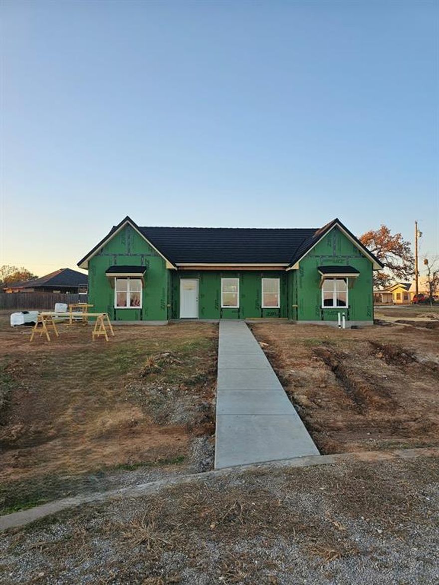 New Construction • Energy-Efficient • Home location is USDA Eligible with zero down! Experience exceptional living in this beautifully designed 3-bedroom, 2-bath, 1,364 sq ft new construction home, complete with a rear-entry carport and abundant parking. Thoughtfully crafted for comfort, efficiency, and durability, this home truly stands out. Step inside to an inviting open-concept floorplan—perfect for entertaining and everyday living. The spacious kitchen is ideal for meal prep, serving, or gathering with family and friends. A split-bedroom layout provides added privacy, making the primary suite a peaceful retreat. Built with long-term savings and structural integrity in mind, this home offers numerous high-performance features, including:  • Spray foam insulation • 2x6 walls with monopoly framing for superior strength and efficiency • Zip System sheathing delivering an air- and moisture-tight seal from slab to roof • Hardie Board concrete siding • Expertly waterproofed vinyl windows.  Topping the list of premium upgrades is the stone-coated steel Tek-Roof, boasting a Class 4 impact rating, resistance to hurricane-force winds, and protection from hail up to 2 inches—all designed to enhance durability and reduce insurance costs. Inside, you’ll appreciate the low-maintenance vinyl flooring, granite countertops, and quality craftsmanship throughout. A high-efficiency 16 SEER Trane HVAC system paired with an Aprilaire Fresh Air System ensures superior comfort and indoor air quality year-round. This home isn’t just beautifully built—it’s a smart investment in comfort, quality, and energy savings. USDA ZERO-DOWN financing available!  Don’t miss this energy-smart gem—schedule your private tour today!