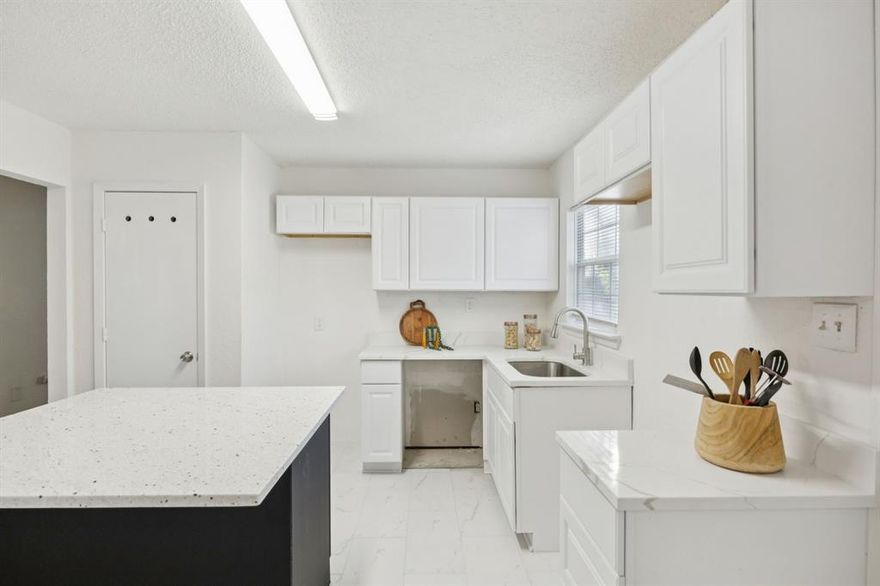 Charming 3-bedroom, 1-bath home that’s move-in ready! Freshly painted inside and out and new roof installed September 2025, this home offers an open-concept layout with abundant natural light and hand-scraped hardwood floors throughout the living, dining and two bedrooms. The updated kitchen features quartz counters, new cabinets and a seamless flow into the dining area—perfect for entertaining. Three spacious bedrooms provide plenty of comfort and flexibility. Step outside to a large backyard with mature trees, ideal for pets, gatherings, or relaxing evenings, plus a detached 1-car garage for convenience and extra storage. GE Dishwasher, range and microwave will be installed upon executed contract. Located with easy access to Hwy 635 and just minutes to White Rock Lake and the Dallas Arboretum, this home combines comfort, convenience, and value. Perfect for first-time buyers or anyone looking for a cute home with a fantastic yard!