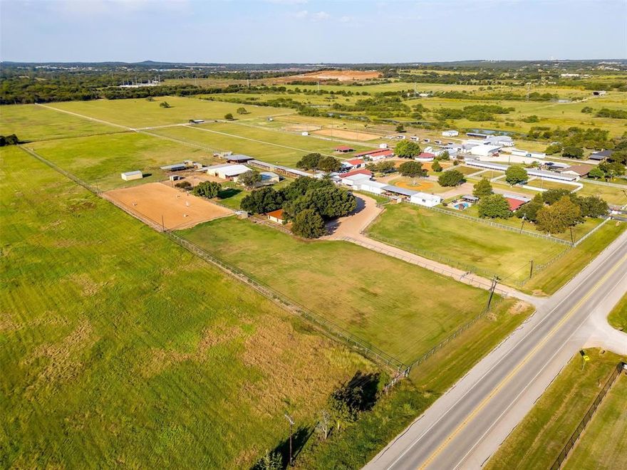 10 Acres and Another 10 Acre lot is available!!!  Right Here in the Heart of Burleson, This 10 acre fully pipe fenced Turn Key Farm and Ranch property has lots to offer. Starting with the long driveway that separates two large turnout pastures with covered loafing sheds, to follow is the sprawling Ranch Style Home that accommodates, 3bedrooms 2full bath, 2family rooms a kitchen, that is the heart of the home, a dinning area, and so much more to offer. Every room feels very spacious. From the back of the home you overlook the 40 by 60 show barn that contains, concrete flooring 4 stalls a feed room, tack room and storage room,  2 wash racks located at the front of the barn and the back. A large 5,000 pound working grain bin attached. Another 40 by 60 barn that includes 3 stalls, a concrete walk way. This  barn also holds a concreted area with a horse stock, sink , hot water heater, along with a 12 by 24 office that contains a restroom and shower.  The third barn is a 20 by 30 fully inclosed hay barn. More stalls along the side of the property as well.     Holding a total of 30 horse stalls and 10 outdoor pens that each have a loafing shed for cover. This Ranch also holds a 55ft covered round pen, 6 horse walker, 250 by 125 piped riding arena. If you think it didn't already have everything well it does, it also has a large 5 acre pasture that can be used to produce hay or for turnout.  This Ranch has hosted many Burleson FFA and 4H judging practice shows, given lots of riding lessons, boarded horses and used as an equine breeding facility. The Income or Investment  potential is Unlimited Here, being minutes from Burleson with all the amenities, but yet still outside of the city limits.  You can use this Property for Income or just be kept to yourself to enjoy the peacefulness it has to offer.   Schedule that showing today!! Serious enquires only please.