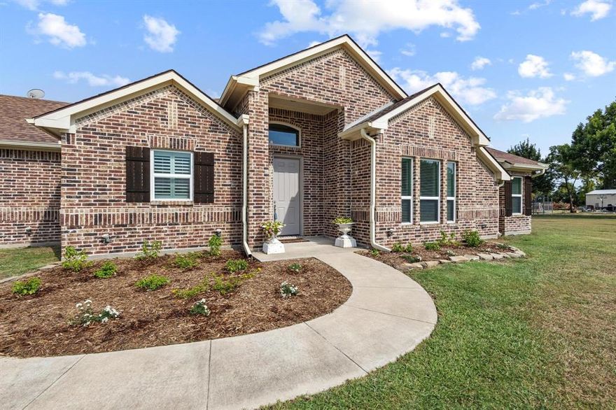 Beautiful custom brick home on nearly 2 acres near Lake Lavon! This 3-bedroom, 2-bath property combines country living with modern comforts, less than an hour from the DFW Metroplex. Designed with an open-concept layout, the home feels light and bright throughout, with vaulted ceilings and a stunning stone fireplace creating a warm, inviting centerpiece.

Quality craftsmanship is evident in every detail, from solid core doors and 36” wide entries to rich wood trim and energy-efficient spray foam insulation. The spacious kitchen and dining area flow naturally into the living room, making entertaining effortless while maximizing natural light and views of the surrounding property.

The owner’s suite is a peaceful retreat, while two additional bedrooms offer flexibility for family, guests, or a home office. Two full baths are thoughtfully designed with comfort and practicality. High-end finishes and durable construction make this home as functional as it is beautiful.

Outdoors, the nearly 2-acre lot provides space to relax, garden, or customize to your needs. From the north side, enjoy tranquil views of Lake Lavon—reminding you daily that nature’s beauty is just beyond your doorstep. With endless possibilities, there’s room here for outdoor living, a workshop, or a future pool.

Located in a quiet country setting with easy access to shopping, dining, and recreation, this property offers the best of both worlds. Lake Lavon is close by for boating, fishing, and hiking, and major highways make commuting easy.

A rare opportunity to own a high-quality, custom home with land and lake views—schedule your showing today!