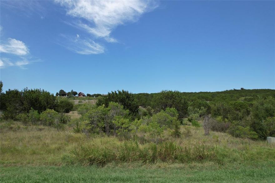 Two acre lot in the fabulous and scenic Hills Above Possum Kingdom. This lot is in the middle of a quiet culdesac and has lots of trees. <ostly flat and level this lot is a great lot to build on. Lot ownership permits the use of all of the amenities in The Hills including; boat storage, clubhouse with pool and fitness center, community dock, boat ramp, lakeside cabin with covered patio, picnic area and grills, lakefront area, fishing pond, park, and twenty miles of roadway behind the gates.