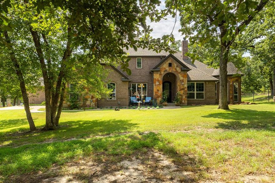 Nestled in the Hilltop of Ft Worth, is this One-of-a-Kind Gem! This one owner, 10-acre ranch home features 4 bedrooms with built in wooden shutters, office with walk in safe room, media room, 3.5 baths, 2 car garage. a bath rm leading to the pool area. Every detail of this custom-built home was meticulously thought out and built with exquisite craftsmanship beginning with the floors, the hand-crafted doors to the beams on the ceiling and many more details throughout. The open floor living space flows seamlessly offering endless entertaining opportunities. The chef’s kitchen and large granite island is perfectly designed for your entertainment taste. From the kitchen to the living area, where the large sliding doors open fully and lead you to the outside covered patio and the gunite pool. The large covered back patio, offers a beautiful stone fireplace, outdoor kitchen with bar offering plenty of sitting area for entertaining – or- simply a great spot to savor the beauty of the country sunrises and stunning sunsets. The large primary suite offers an oversized custom walk-in closet, a beautiful free standing soaking tub, separate shower and a private door leading out to the covered patio and pool area. Adjacent to the main property sits a 859 sqft (included into SqFt, Living Area) guest house offers a full kitchen, 1 bdrm, 1 bath, WB fireplace and a 3-car garage. This ranch is a true escape from the city life and the perfect place to call home. Just located 20 Minutes to Dtwn Ft Worth and 50 min to Dallas! This listing is currently AG Exempt and sits outside the city limits, main house and guest home (sit on 2 acres) and an additional 8 acres – is completely fenced for livestock (Parcel IDS- 41654935 and 41717341) COME SEE this well-maintained property! Owner will N0T subdivide. Additional 5 acres is available adjacent to the property that is fully fenced and includes a 5 stall horse barn-- see MLS# 21037173
