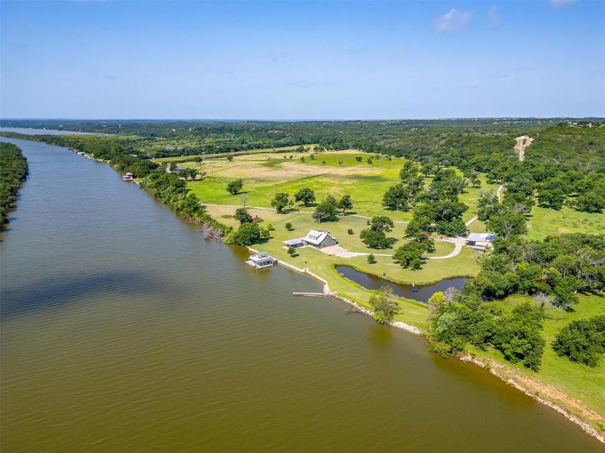 Tin Top River Ranch - Just 45 minutes from Downtown Fort Worth, discover a farm, a horse ranch, a hunters paradise, and a deep water lake house all rolled into one with incredible 20 miles views! Nestled along the scenic Brazos River in northern Hood County, this property is a true sanctuary for nature lovers, outdoor enthusiasts, and those seeking tranquility. Imagine having your boats, horses, and hunting grounds all in one place. Here, you can immerse yourself in a world where every day holds adventure. With 140 feet of elevation changes, you’ll enjoy breathtaking views and the chance to explore miles of rugged terrain. Get lost in the woods, hunt trophy deer, or cultivate your land with hay for your horses or sunflowers for dove hunting. Picture yourself fishing in your private ponds or navigating 35 miles of the Brazos and Lake Granbury right from your backyard. You’ll have the rare opportunity to enjoy lakefront living while also embracing all the opportunities of a ranch. As the sun sets, gather with family and friends on the back porch or the covered pavilion, where memories are made against a backdrop of stunning river views. Whether you're hunting deer, dove, duck, turkey, or simply observing the wildlife, this property is a haven for those who appreciate the beauty of nature and the joy of outdoor living. You won’t ever have to worry about neighbors across the river ruining your views or your day, making this a private retreat that feels worlds away, yet remains conveniently close to urban amenities. This extraordinary ranch combines the best of both worlds—a lake house and a ranch—making it the ultimate retreat for family, friends, and generations to come. Experience the joy of outdoor living, the thrill of adventure, and the peace of mind that comes with owning a piece of Texas paradise.