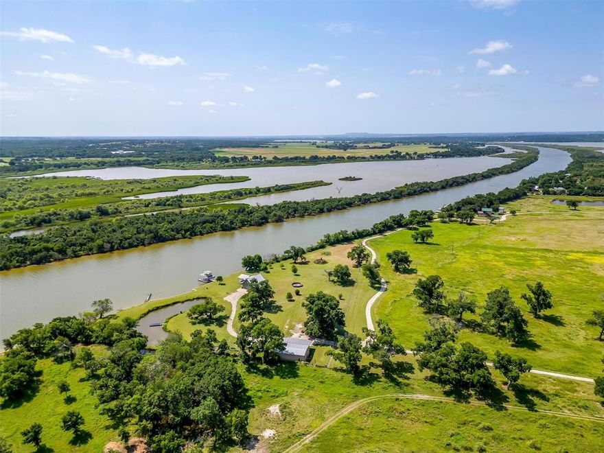 Tin Top River Ranch - Just 45 minutes from Downtown Fort Worth, discover a farm, a horse ranch, a hunters paradise, and a deep water lake house all rolled into one with incredible 20 miles views! Nestled along the scenic Brazos River in northern Hood County, this property is a true sanctuary for nature lovers, outdoor enthusiasts, and those seeking tranquility. Imagine having your boats, horses, and hunting grounds all in one place. Here, you can immerse yourself in a world where every day holds adventure. With 140 feet of elevation changes, you’ll enjoy breathtaking views and the chance to explore miles of rugged terrain. Get lost in the woods, hunt trophy deer, or cultivate your land with hay for your horses or sunflowers for dove hunting. Picture yourself fishing in your private ponds or navigating 35 miles of the Brazos and Lake Granbury right from your backyard. You’ll have the rare opportunity to enjoy lakefront living while also embracing all the opportunities of a ranch. As the sun sets, gather with family and friends on the back porch or the covered pavilion, where memories are made against a backdrop of stunning river views. Whether you're hunting deer, dove, duck, turkey, or simply observing the wildlife, this property is a haven for those who appreciate the beauty of nature and the joy of outdoor living. You won’t ever have to worry about neighbors across the river ruining your views or your day, making this a private retreat that feels worlds away, yet remains conveniently close to urban amenities. This extraordinary ranch combines the best of both worlds—a lake house and a ranch—making it the ultimate retreat for family, friends, and generations to come. Experience the joy of outdoor living, the thrill of adventure, and the peace of mind that comes with owning a piece of Texas paradise.
