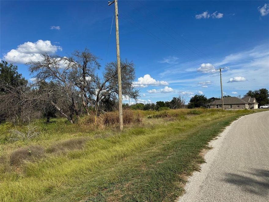 Build your dream home or vacation getaway in King’s Point Cove at The Hideout Golf Course Resort near Lake Brownwood! This spacious residential lot is approximately 0.36 acres—larger than most in the community—giving you extra room to design the perfect layout. Located on a quiet street with paved road frontage, the lot already has access to water, electric, and sewer.

One of the best features of this property is its location near the 3rd fairway of the King’s Point Cove Hideout Golf Course. As an owner, you’ll enjoy free rounds of golf, making this an outstanding choice for avid players or those who simply love the scenic golf course lifestyle.

The Hideout Resort offers a wide range of resort-style amenities to fit every lifestyle. Cool off in the infinity pool, relax in the hot tub, or stay active in the fitness center. The multi-purpose sports court is perfect for tennis, pickleball, or basketball, and you’ll also find a beach volleyball court, children’s playground, paddle boating, and fishing opportunities. Whether you’re entertaining family, hosting friends, or enjoying a quiet weekend, this neighborhood has something for everyone.

In addition, the adjoining Lot 721 is also available. Together, the two lots total more than two-thirds of an acre and are offered at a discount when purchased as a package. This rare opportunity allows you to create a larger homesite with more space and privacy, or hold one lot as an investment for the future.

Just minutes from Brownwood, you’ll have easy access to schools, shopping, medical facilities, and restaurants while still enjoying the peace of lake and golf course living. Whether you plan to build now or hold for later, this lot—and the option to own two side by side—makes King’s Point Cove an exceptional choice for Texas resort living.