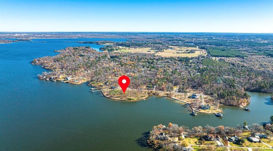 This is not just a piece of land; it's an invitation to a lifestyle—one defined by the beauty of East Texas Pines, the serenity of the lake, and the endless possibilities for creating memories with family and friends.  Situated in the small gated community of Emerald Shores on Lake Bob Sandlin, this prime piece of real estate offers an expansive 246' of waterfront, providing an unobstructed view of the main lake.  A fully boathouse capable 1+ acre lot with new retaining wall and stairs ($60K value) into the lake allowing plenty of space to design and build your dream lakeside retreat.  AND - Short Term Rentals ARE allowed in Emerald Shores giving revenue generation capability.

Whether you desire a contemporary lakeside retreat, a rustic cabin, or a modern architectural masterpiece, the possibilities are limited only by your imagination.  There are so few waterfront lots left on this amazingly beautiful lake.   Don't miss your opportunity to start and build a generational legacy.