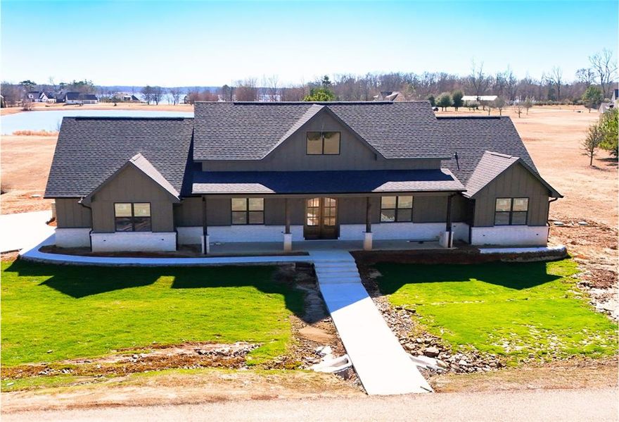 Experience the best of both worlds with this stunning .880-acre property offering pond frontage and beautiful lake views in the prestigious The Peninsulas at Lake Bob Sandlin. Enjoy direct waterfront access on the pond perfect for building your very own private fishing pier while also taking in scenic views of Lake Bob Sandlin.  This thoughtfully designed home features 3 bedrooms, 3 full bathrooms, plus a dedicated office or bonus room. The layout was created with entertaining in mind, showcasing custom features throughout the kitchen, pantry, and living areas.  The show stopping, oversized walk-through pantry offers exceptional storage, space for a second refrigerator, a wine fridge, and a convenient grocery loading access window, door directly from the garage making everyday living effortless. The garage is already equipped with a connection for an electric vehicle.
The open living space flows beautifully for hosting family and friends.  The private primary suite is thoughtfully separated from the additional bedrooms, creating a true retreat. A spacious laundry room is conveniently located just off the primary suite for added comfort and functionality. The oversized walk-in closet features built-ins and offers direct access to the laundry room from the primary closet for ultimate convenience.
Step outside to the back patio, already equipped with gas grill hookups and electric access perfectly set up for outdoor entertaining and enjoying peaceful waterfront evenings. Located in a gated waterfront community, residents enjoy access to approximately 9,000 acres of boating, fishing, swimming, and year-round recreation on Lake Bob Sandlin, along with 3.3 miles of scenic hiking trails that wind along the shoreline.
Just 2 hours from Dallas and approximately 1 hour from Texarkana, this home offers peaceful lake living with convenient accessibility.
Build your memories here where lake views, pond frontage, and luxury living come together.