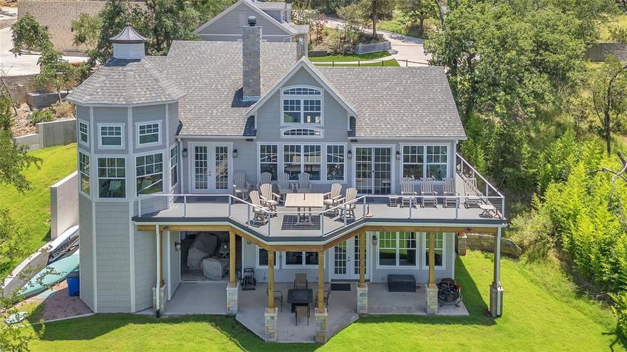 Nestled along the tranquil shores of the lake, this stunning 5-bedroom, 5 full and 2 half-bath estate offers the perfect blend of luxury, comfort, and breathtaking views. The open-concept main living area seamlessly connects the living room, dining space, and gourmet kitchen, all framed by expansive windows that showcase panoramic lake vistas. Step outside onto the large upper or lower decks—ideal for entertaining or simply
soaking in the serene surroundings. The spacious master suite is a true retreat, featuring a cozy seating area, private patio
access, and sweeping lake views. The ensuite bath boasts a large walk-in shower and elegant finishes. Two additional bedrooms on the main level each offer private ensuites, ensuring comfort and privacy for family or guests. Downstairs, a massive game and family room awaits, complete with a second kitchen and direct access to multiple patio areas that lead to an open lawn and your private dock—perfect for lakeside living. Adding to the appeal is a separate guest house, thoughtfully designed with two bunkrooms, each with its own full ensuite, and a versatile third room that can serve as a sleeping area, game room, or den. The guest house also includes a convenient coffee bar and beverage fridge, making it a self-contained haven for visitors. With abundant storage throughout and every detail designed for both relaxation and entertaining, this lakefront gem is a rare opportunity to own a piece of paradise.