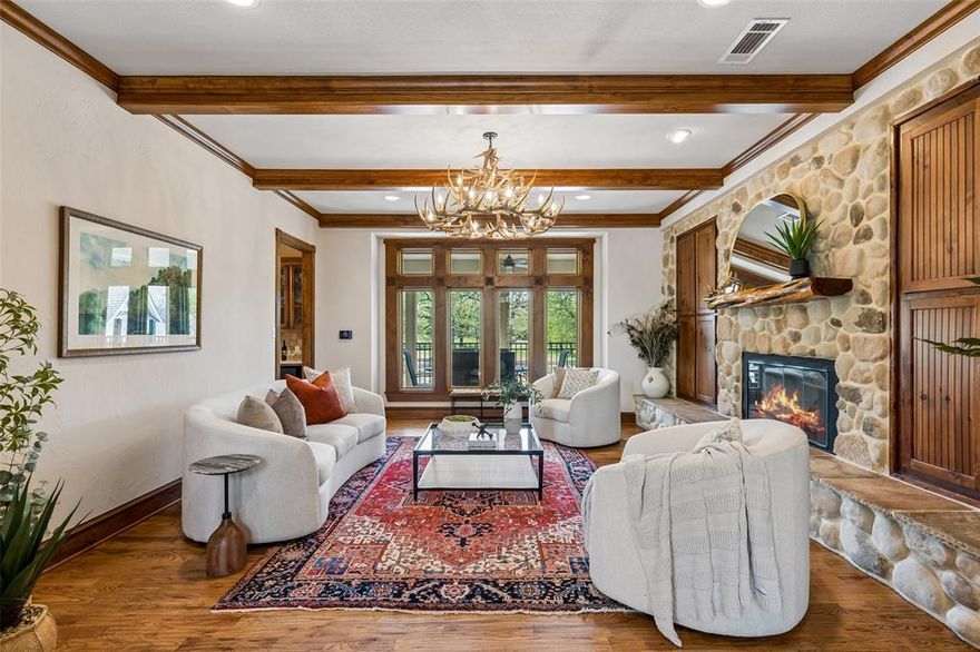 Tucked behind private gates on 18.5 acres, this distinguished Granbury estate delivers a rare combination of luxury living and ranch life—all just minutes from the town square. The custom stone residence spans over 7,300 square feet and was designed for both everyday comfort and large-scale entertaining. Expansive living areas, a dedicated media room, and a game room create a seamless flow, while the outdoor spaces—complete with a resort-style pool and outdoor kitchen—extend the living experience beyond the home. Equestrian improvements are equally compelling, featuring a well-designed barn with 14 stalls, multiple fenced pastures, and loafing sheds. A separate foreman’s home and guest house offer versatility for staff, guests, or multigenerational living. Recent updates and thoughtful upgrades throughout the property include new windows, updated appliances, quartz surfaces, wood flooring, and a fully integrated security system. A reinforced safe room provides added peace of mind. The land itself is both beautiful and functional, with a pond, mature hardwoods, and carefully maintained, low-maintenance landscaping. A solar power system with Tesla battery backup adds a forward-thinking element of efficiency and sustainability. Additional features include an oversized shop, fiber optic internet, and a private circular drive that enhances both convenience and curb appeal. A property of this caliber—offering privacy, usability, and proximity to Granbury—is increasingly hard to find.