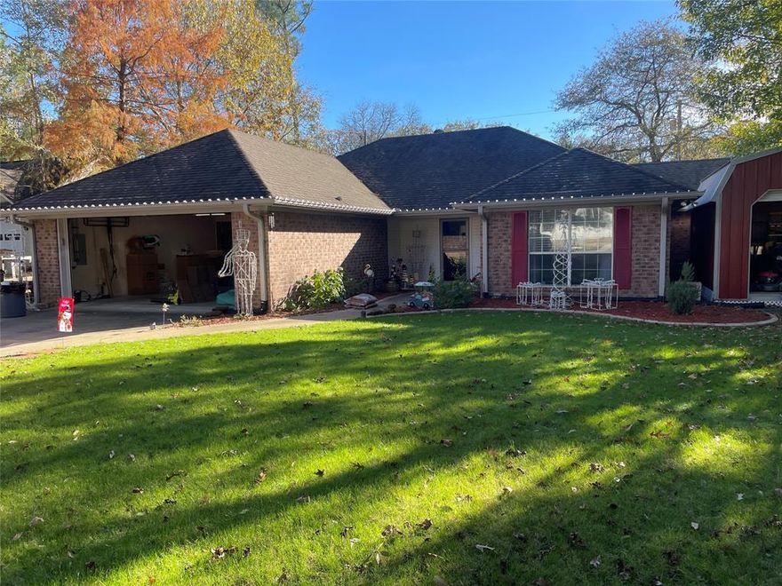 Charming brick home in this Leon Howard designed golf course community in the gated subdivision of Holly Lake Ranch.  The precious home boast 2 bedrooms 2 bathrooms and was updated in 2019. The well-appointed kitchen adjoins the breakfast area which features beautiful granite countertops. There is ceramic tile flooring in the kitchen and family room, as well as a cozy fireplace. The bedrooms are split and the primary en-suite has dual lavatories and two walk-in closets. There is an enclosed air-conditioned sunroom behind the kitchen to sit and enjoy the plethora of deer and other wildlife. Outside is a covered pergola area within the fenced back yard. Beyond the fence is an undeveloped 11.5 acres that is owned by Holly Lake and will not be developed. The yard has a sprinkler system and a 16 X 22 storage shed. Amenities included in Holly Lake are walking trails, Tennis and Pickleball courts, a fitness facility, lakes to fish and kayak, swimming pools, 24 hr. security, and an 18-hole golf course, putting green, pro shop, and a 19th hole bar and restaurant.