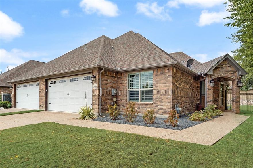 Welcome to this gem in the Giverny Townhomes 55+ Gated Community! This beautifully maintained home is filled with thoughtful upgrades and features a rare floorplan offering 3 bedrooms, 2 baths, plus an additional flex room that can serve as a 4th bedroom, office, workout space, or hobby room. Homes with this versatile layout are rarely available in this community! Inside, you’ll find engineered hardwood floors in the main living areas, plush carpet in the bedrooms, and wide doorways for easy accessibility. Both bathrooms feature walk-in showers for convenience, while plantation shutters throughout the home add timeless elegance. The kitchen is appointed with stainless steel appliances (refrigerator included!) and ample storage, and the washer and dryer are included as well—a valuable bonus for move-in readiness. Additional attic storage is perfect for seasonal items. The 2-car garage boasts a durable polyaspartic floor coating, and the spacious backyard provides plenty of room for pets and grandchildren to play. A unique highlight is the heated and cooled building with a full-size hot tub—perfect for entertaining, relaxing, or cheering on your favorite team. The Giverny Townhomes community is secured with a gated entrance for peace of mind. The affordable HOA maintains front and backyard lawns, making this a true “lock-and-leave” lifestyle. Amenities include a swimming pool, clubhouse, and beautifully kept grounds. Located just minutes from Downtown Fort Worth, the Hulen area, Clearfork shopping, and top-tier medical facilities, this home offers convenience, comfort, and community living all in one. Don’t miss your chance to call this beautiful home yours — schedule your private showing today!