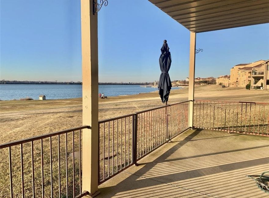 WATERFRONT!! Gorgeous 2 bedroom 2 bath condo on Lake Ray Hubbard.  This spacious condo has been meticulously maintained & cared for and it shows. Upon entering you will be welcomed by breathtaking views of the water.  Light & bright open floorplan allows you to cook in the kitchen and cozy up to your fire in the living room while enjoying waterfront views.  Kitchen has stainless steel appliances, wrap around cabinetry and a gas stove to satisfy all your culinary needs.  Living room has a gas fireplace w gas logs to welcome you on these chilly evenings.  Signal Ridge Condominium is located next to The Harbor so you can walk over to enjoy dining, movies and entertainment at your leisure. Gated. 2 Swimming pools.