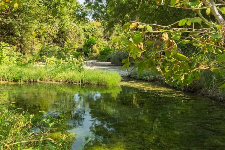 16.509 acres of beautiful improved land near Lake Granbury with approximately 767 feet of Stroud Creek frontage. The creek feeds into the Brazos River basin and supports fishing and kayaking. The property features mostly level ground with minor elevation changes and a small hill. Partially wooded with mature hardwoods, including century-old live oaks and pecan trees. Electricity is on site, with a new water well to be installed. All mineral rights convey. Suitable for ranching, building, or holding quality Texas land with water and utilities in place.