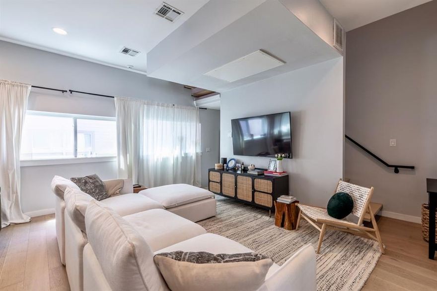 Experience elevated urban living in the heart of Dallas at 4920 Zuma Court, ideally situated just steps from the vibrant Knox-Henderson corridor. This impeccably maintained contemporary townhome offers a blend of luxury, functionality, and a low-maintenance lifestyle—all within a secure, gated community with a low HOA. Upon arrival, you'll be welcomed by sleek modern architecture and a private entrance. The first floor features a spacious guest suite with a full en-suite bathroom, ideal for visitors, roommates, or a private office. You’ll also find a dedicated laundry room, attached garage access, and a private fenced yard—perfect for pets or peaceful outdoor enjoyment. Upstairs, the second level opens to a sun-drenched living space with hardwood floors, soaring ceilings, and an open-concept design ideal for entertaining. The chef-inspired kitchen is outfitted with quartz countertops, stainless steel appliances, custom cabinetry, and a large island that seamlessly connects to the dining and living areas. The luxurious primary suite offers a tranquil retreat with a large walk-in closet and a spa-style bath featuring dual vanities, a soaking tub, and a separate glass-enclosed shower. A versatile third-floor flex space offers endless possibilities—whether for a home office, fitness area, or creative studio. Cap it all off with a private rooftop deck offering panoramic city views—perfect for hosting, relaxing, or enjoying your morning coffee under the Dallas sky. Located just moments from Henderson Avenue’s shops, restaurants, and nightlife, and with quick access to Lower Greenville, Uptown, and Downtown, this townhome captures the essence of modern living in one of Dallas’s most sought-after locations.