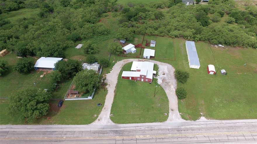 PRICE REDUCED!!! Great opportunity to own a turn-key veterinary clinic or create another small business or possibly convert this building to a home! Previously utilized by Dry Fork Veterinary Clinic serving the surrounding community large and small animal needs. Multiple exam rooms with surgery center and boarding area. Nice reception guest area with office. Large set of working pens and lots with loafing sheds for livestock and larger breed animals. Great location 15 MINUTES TO WICHITA FALLS just off of Highway 148 with easy access to US 82 & 287.