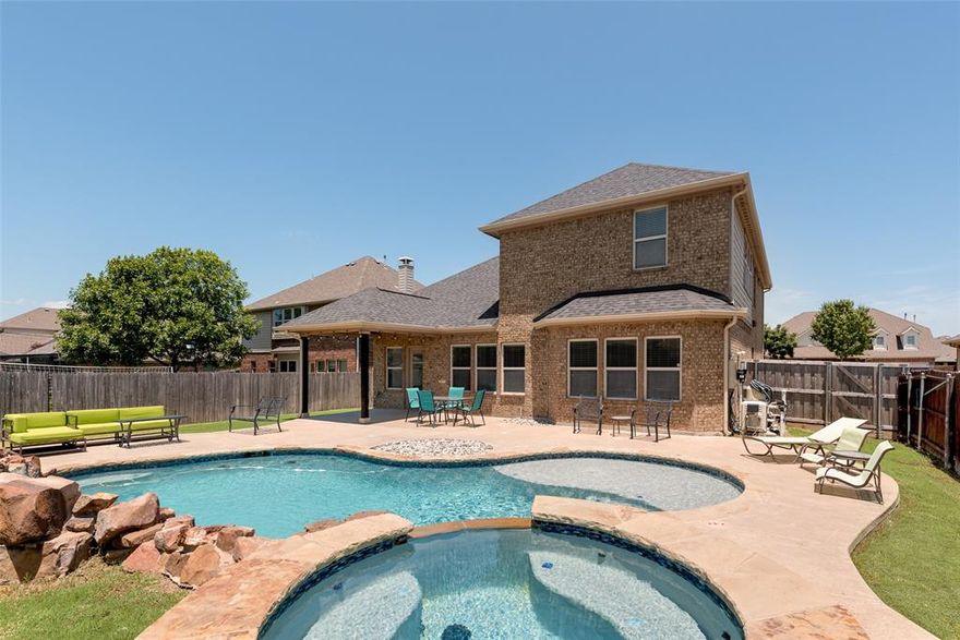 Discover this stunning two-story home in Verandah before it’s gone! Meticulously maintained, this home features beautiful laminate wood flooring throughout the main level and carpet upstairs. Enjoy the highly sought-after open-concept layout, where the stylish kitchen—complete with elegant over- and under-cabinet lighting—flows seamlessly into the spacious family room, perfect for entertaining or relaxing. Upstairs, a versatile game room creates a functional split-bedroom design, offering privacy between the primary suite and the three secondary bedrooms. With numerous upgrades throughout, this home is sure to impress. Step outside to your own backyard oasis—truly one of a kind and ideal for unwinding or hosting gatherings. Don’t miss your chance to make this exceptional home yours!