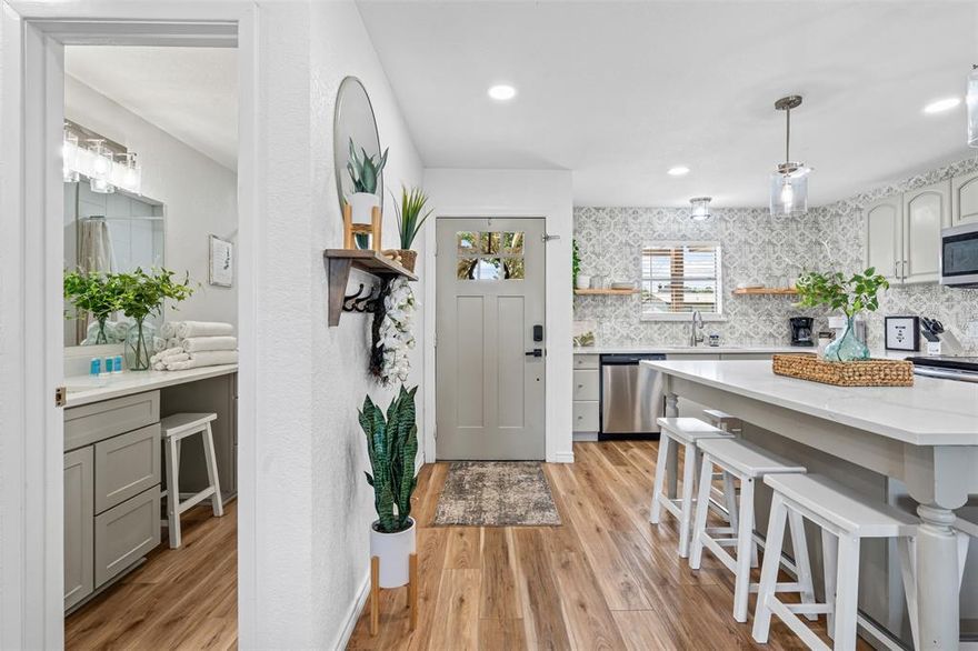 Step into lake life with this stylishly updated getaway on the Fort Worth side of Granbury, just a few houses from the mainbody water! Currently a thriving short-term rental with steady bookings, this turn-key property comes fully furnished—everything you need to start enjoying or earning from day one. Renovated in 2023, it boasts a fresh HVAC system, new appliances, sparkling quartz countertops, luxury vinyl wood flooring, updated light fixtures, and completely refreshed bathrooms. Outside, unwind by the fire pit under the stars, then hop into the hot tub for the perfect end to your day. Recent upgrades include new boat slip decking, retaining wall, and iron fencing. Whether you’re looking for your own weekend escape or a proven income-producing investment, this lake house delivers the ultimate blend of comfort, style, and location.  New roof and gutters in July 2025. All furnishings, fire pit, and hot tub convey with the property. Scheduling for viewings must be made in advance to keep with rental bookings.