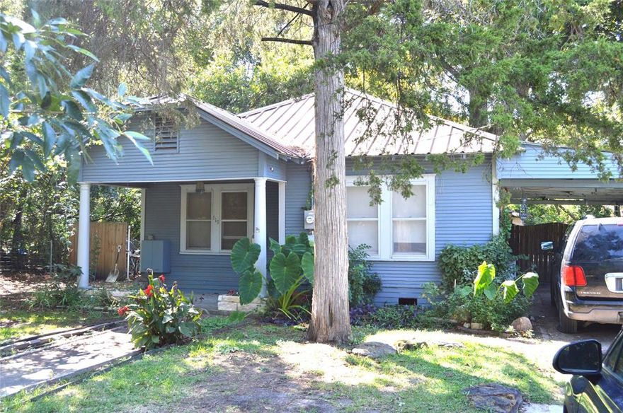 3 Bedroom 1Bath Frame Home sold as is needs a little TLC Has a covered Deck outside fireplace and a work shop in back.  Would be great for a first time buyer to make it their own also could be a good income property close to down town and schools and shops.