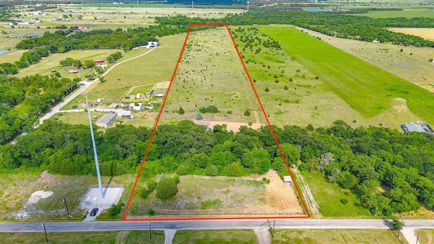Escape to the peace and privacy of country living with this 3 bedroom, 2 bath double wide mobile home situated on 15 beautiful acres in Waxahachie. Tucked away behind a long private driveway that crosses over a creek, this property offers a secluded setting surrounded by nature and endless possibilities. The 1,120 sqft home features a covered front wood deck perfect for enjoying quiet mornings and relaxing evenings in the countryside. While the home does need some TLC, it presents a great opportunity to customize and make it your own. The property also includes an 8x8 storage shed for extra storage space and is partially fenced, offering potential for livestock, recreation, or future improvements. The property is currently ag exempt with 10 bee hives in place, offering added value and potential tax benefits. Whether you’re looking for a fixer-upper investment, a weekend retreat, or a place to build your dream country homestead, this acreage property combines privacy, character, and room to grow just outside the city limits.
