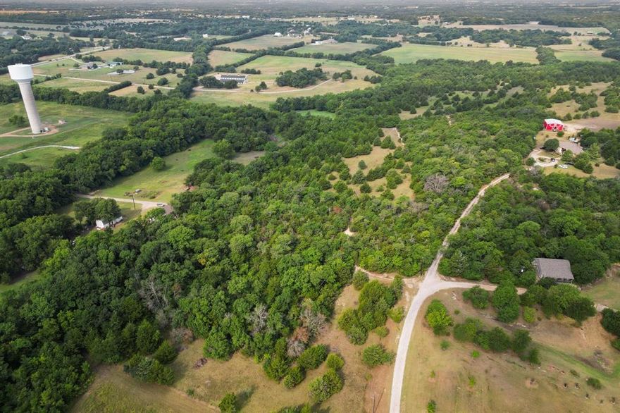 Welcome to 25+ acres of picturesque land in Van Alstyne, Texas. This beautiful property boasts a highly rated school district, making it the perfect place to build your dream home and raise a family. Surrounded by mature trees, this acreage offers privacy and seclusion, creating a peaceful retreat away from the hustle and bustle of city living. Don't miss this opportunity to own a piece of paradise in one of the most sought-after areas in North Texas. Electricity is available right on the front of the property, water is on the corner of Wild and Dancing Meadows. Both are easily accessible!
Parcel 133204 has 21.18 acres and Parcel 133275 has 4.495 acres. See MLS #21209732 for the additional acreage available.