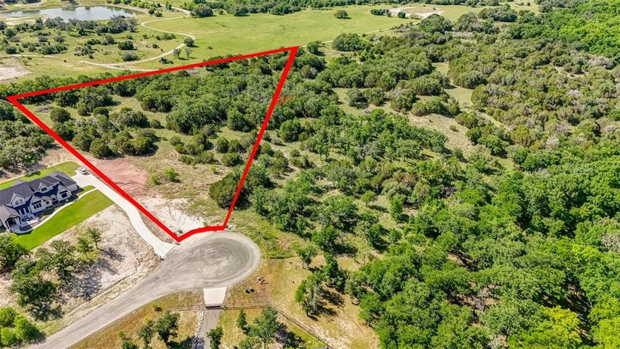 ONE OF THE BEST LOTS IN THE HIGHLY DESIRABLE EAGLE'S BLUFF DEVELOPMENT * LOCATED AT THE BACK OF THE NEIGHBORHOOD, IT IS SITUATED IN ROLLING TERRAIN AND FEATURES A FULL COHORT OF MATURE NATIVE OAK TREES * LOCATING YOUR HOME HERE WILL BE LIKE LIVING IN THE GARDEN OF EDEN IN RURAL NORTH TEXAS WHILE STILL BEING LOCATED JUST 30 MINUTES WEST OF THE DFW METROPLEX * BRING YOUR CUSTOM BUILDER AND PLACE YOUR DREAM HOME AMONG THE STATELY OAK TREES * SITUATED AT THE END OF A CUL-DE-SAC AND AT THE BACK OF THE SUBDIVISION, YOU WILL BE AS SECLUDED AS YOU COULD WANT TO BE * SURROUNDED BY SOPHISTICATED STATELY HOMES THIS IS THE PERFECT PLACE TO INVEST IN YOUR OWN DREAM HOME * PICTURESQUE SETTING INCLUDES AN ARRAY OF TOPOGRAPHICAL FEATURES * WHILE LOCATED OUTSIDE OF THE CITY LIMITS, THIS PROPERTY HAS A WEATHERFORD MAILING ADDRESS, AND IS IN THE BROCK SCHOOL DISTRICT * AT&T FIBER OPTIC INTERNET AVAILABLE * THIS DEVELOPMENT HAS NEIGHBORHOOD PONDS FOR FISHING AND PAVILIONS FOR GATHERINGS AND ENTERTAINING