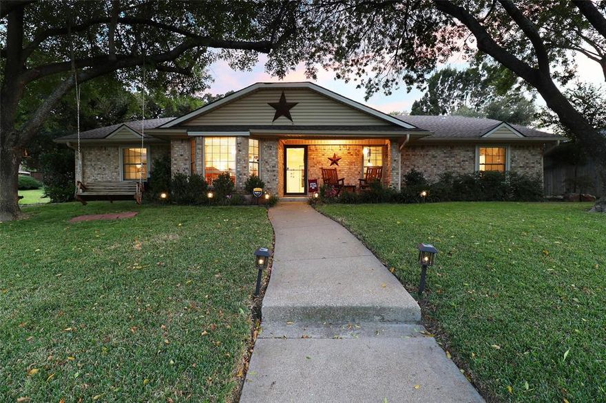 Welcome Home to the Neighborhood You've Dreamed Of - A place where kids grow up together, running & playing freely! Step into this beautifully maintained 4 bed, 2 bath home with a sparkling in-ground pool. The living room welcomes you with vaulted ceilings and exposed beams, a cosy wood-burning fireplace, and stunning Acacia engineered wood flooring throughout the main areas. The formal dining room features a tray ceiling and bay windows creating an elegant space for entertaining. The kitchen features include granite countertops, Shaker-style cabinetry, granite counters, a breakfast bar, & a convenient coffee station. The primary suite is a true retreat boasting of an updated bath with separate vanities, one with a makeup station, granite countertops, a walk in shower with travertine tile & granite bench, and a large walk-in closet with custom Elfa shelving. Secondary bedrooms are spacious, two of which have walk-in closets. Entire home has 4-stage reverse osmosis whole home water filtration system, water softener & sediment filter system & Fully owned paid off solar panels for energy efficiency as well as radiant barrier in the attic! Home also features a built in Tornado Shelter in the garage.  Step outside & host unforgettable gatherings in your private backyard oasis, complete with covered patio & inviting pool (resurfaced in 2019) with turf & dog run, and removable safety fence and gate for pool. On top of that the roof was replaced in 2020! This home has it ALL - comfort, efficiency, timeless style & a true community! A short walk away from River Legacy Park, Dunlop Park, and Butler Elementary.