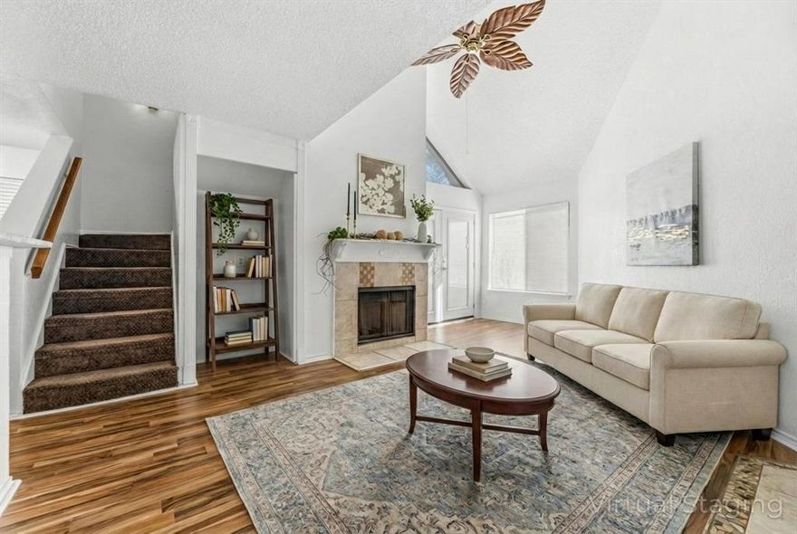 This updated Arlington Oaks condo features a functional layout with recent mechanical improvements, including a new HVAC system installed in 2024, as well as a new electric water heater and electrical panel replaced in 2023. The interior offers a spacious living area characterized by vaulted ceilings and a traditional fireplace. The floor plan provides one bedroom with an ensuite on the main level, while the second bedroom and ensuite are privately situated on the upper floor. A full electric appliance package is included in the kitchen. For a proactive safety feature, the unit is equipped with a synchronized, building-wide fire alarm system featuring interconnected sensors on both levels for immediate notification. Residents have access to a comprehensive amenity package including two pools, two jacuzzis, a fitness center, sauna, and tennis courts. The property includes one assigned carport space and is located approximately 2 miles from the Arlington Entertainment District (AT&T Stadium and Globe Life Field) with immediate access to I-30 for convenient commuting.