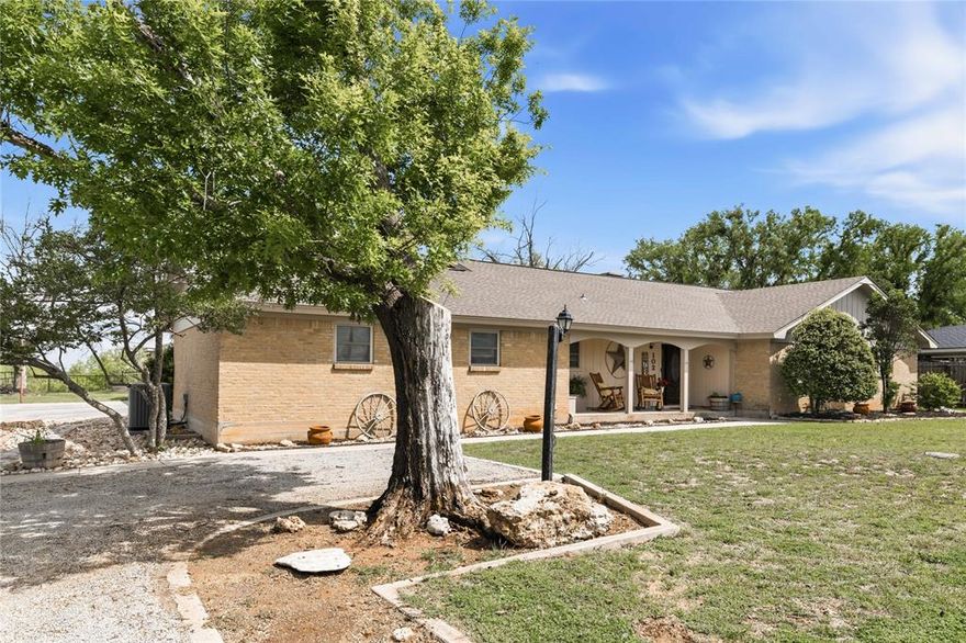 Perched atop a hill in the highly desirable Lori Lane neighborhood, this 4-bedroom, 2-bath home offers the perfect combination of space, functionality, and scenic views all while sitting on a large oversized lot coming in at .76 acres. Enjoy elevated living with beautiful sightlines that create a peaceful, private setting while still being conveniently located near town. Inside, you’ll find a spacious and versatile layout designed for both everyday living and entertaining. The kitchen features granite countertops, ample cabinetry, and plenty of workspace, making it as functional as it is inviting. The main living area provides a comfortable gathering place with exposed wood beams in the ceiling and large brick fireplace, while the second living room is set up like a home theater—perfect for movie nights, game days, or a dedicated entertainment space. The four bedrooms offer flexibility for families, guests, or work-from-home needs, with room to customize to your lifestyle. The primary bedroom features a built in desk area, and the bath features a large tile shower. One of the standout features of this property is the detached bonus room (not included in the home’s square footage), offering endless possibilities. Whether you envision a home gym, private office, man cave, or hobby space, this separate area gives you the freedom to create exactly what you need. Step outside and take in the elevated views that make this property truly special. The hilltop setting provides a sense of privacy and a great backdrop for relaxing evenings or morning coffee. If you’re looking for space, versatility, and a unique setting in Brownwood, this home is a must-see.