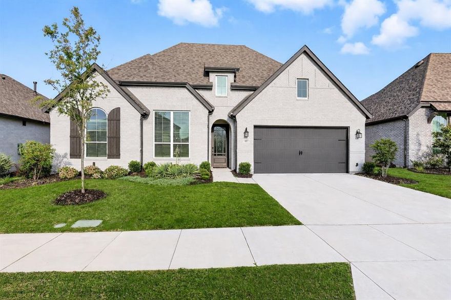 Gorgeous Highland Homes Canterbury floor plan, a rare find in the highly sought after Wildridge a lakeside Community. With over $100K in additional upgrades & custom features after build, this home was designed to impress & built for the family. Step inside to a bright, open layout featuring soaring ceilings, white oak flooring, & abundant natural light. Just off the foyer, is a dedicated study with glass french doors. The expansive living area showcases a custom painted fireplace & flows into the gourmet kitchen, complete with a custom wood vent hood, custom paint, SS appliances, double ovens, gas cooktop, custom lighting & designer hardware. Enjoy family movie nights in your private in home media, or unwind in the extended primary suite, featuring custom tile work, dual vanities, a large soaking tub, walk-in shower, and walk in closet space. The secondary primary suite includes its own en-suite bath and walk-in closet, ideal for guests or multi-generational living. Two additional bedrooms share a well-appointed split bath, and the home also includes a custom-built hidden safe room for added peace of mind!  The three car epoxy coated garage is both air-conditioned and meticulously maintained. The custom laundry room adds functionality with built-in shelving, storage, and a stylish planked wall with custom paint. Step outdoors to your private backyard retreat, featuring an extended patio, tranquil views with no rear neighbors, and a gas stub for an outdoor kitchen or grill, for entertaining. Nestled within a lakeside community, you’re just steps away from Lake Lewisville, where you can launch your kayak or paddle board right from the community. Explore over 7+ miles of scenic nature trails, frisbee golf, fishing ponds, two resort-style pools, multiple parks, and outdoor spaces that beautifully blend nature and luxury living. **Additional lending incentives & Buyer Concession available, contact listing agent for details**