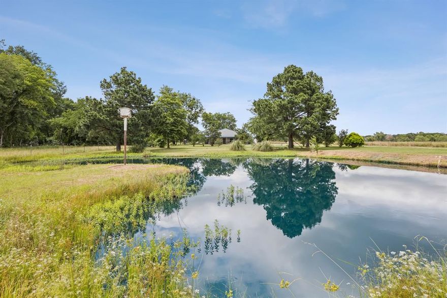 Seller offering $5,000 credit for cosmetic updates! Refined Country Retreat on nearly 6 Acres – Gated, Private, and Fully Turnkey. Welcome to a rare blend of rural charm, modern comfort, and recreational freedom. This 2,800 sq. ft. custom-built 3 bed, 2.5 bath estate sits on 6 pristine, fully fenced and cross-fenced acres—offering a lifestyle of self-reliance, serenity, and sophistication. This Country Oasis is centrally located, less than 15 miles to Canton, Terrell & Kaufman with easy access to I-20. Arrive through your private gated entrance and drive down your quarter-mile driveway to a secluded sanctuary surrounded by open skies and natural beauty. A wraparound covered porch invites you to relax, entertain, or take in the morning sun with your coffee. Outside, this property is built to serve your dreams—whether they include livestock, leisure, or both: there is a private pond for fishing, floating, or quiet reflection, a dedicated shooting range for target practice or sport, fully fenced and cross-fenced pastures—ideal for livestock or hay production, two large storage sheds for feed, tools, or recreational gear, and room to roam for ATVs, chickens, goats, or cattle.  Inside, soaring ceilings and expansive windows flood the open-concept living, dining, and kitchen areas with natural light—perfect for gatherings or peaceful evenings at home. The oversized master suite offers boutique-level comfort with space to unwind, while the massive laundry room and abundant high-end cabinetry throughout the home keep life beautifully organized. Your new home is energy efficient with foam insulation walls & attic, a tankless water heater, and 2 AC units. Whether you’re a homesteader, hobby farmer, or outdoor enthusiast, this home delivers the flexibility, space, and comfort to live your ideal country life—without compromise.