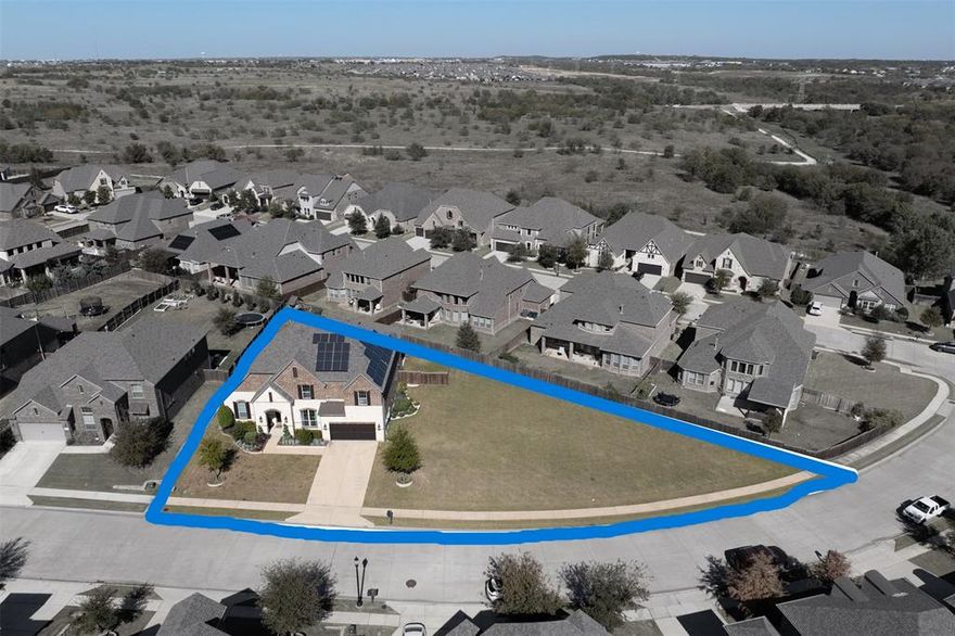 Don't miss this incredible oversized lot paired with a home packed with upgrades in the sought-after Canyon Falls community.
The heart of the home is a chef’s kitchen featuring a Fisher & Paykel 6-burner gas cooktop, Whirlpool double ovens, and a custom built-in bar complete with a Fhiaba wine fridge, refrigerator drawer, ice machine, glass rinse, and Miele coffee machine. A whole-house SpringWell water filtration system with an AquaTru reverse osmosis at both the kitchen and bar sinks ensures every sip and meal is top-quality.
Enjoy built-in Sonos speakers throughout the main level and unwind in a primary suite with a closet that feels more like a boutique—complete with backlit cabinetry, chandelier lighting, and a custom island. The permanent roofline lighting, spray foam insulation, custom built in office cabinets, and large storage shed are just a few of the other noteworthy improvements. This home also features 27 premium LONGi solar panels along with LG ChemRESU 10H Prime battery that powers 8 dedicated areas including the office & internet, both refrigerator outlets, microwave, bar appliances, primary bathroom, and living room. Never deal with full outages again! Don't miss the theater room upstairs that comes with all the equipment you need to entertain from your first day in your new home.
Located in Northlake’s master-planned Canyon Falls, residents enjoy access to resort-style pools, parks, ponds, and miles of trails. This home truly blends high-end living with community charm—an opportunity not to be missed. HOA fees cover internet & cable, full use of amenities, workout center, club house, and even front lawn maintenance, which in this case currently INCLUDES the oversized yard space on the side of the home! You are welcome to fence in the massive side yard and let your imagination run with the space! You could have your pool, your garden, and so much more!