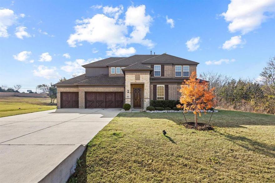 Beautiful home on a full acre near Lake Lavon in Community ISD, set within a serene, wooded, private GATED community!

The spacious primary suite and a desirable secondary bedroom are conveniently located on the first floor, along with a private office featuring elegant French doors. An inviting fireplace anchors the open-concept living area, seamlessly flowing into the stunning kitchen complete with a large island and quartz countertops. Walls of windows frame views of the wooded backyard, filling the space with natural light.

Step outside to a generous covered patio, perfect for outdoor living and relaxation, overlooking the wooded acre lot, offering endless opportunities for exploring, gardening, entertaining, or recreation.

Upstairs, you’ll find two additional spacious bedrooms with walk-in closets, a versatile game room, and a bonus media room. This immaculate home also includes a whole-home generator and surge protector for added comfort and peace of mind.