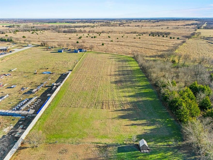 3.545-acre parcel with approximately 2.5 acres available for purchase, located behind the existing mobile home. Buyer has the option to purchase only the rear 2.5 acres or acquire the entire 3.545-acre tract. If purchasing the 2.5 acres, the property will be subdivided and conveyed with an access easement to the rear portion. Property is outside city limits, allowing for multiple potential uses. Conveniently located just minutes from Highway 35W and Highway 67, offering easy access while maintaining flexibility and space. Ideal opportunity for buyers seeking acreage with development or investment potential.