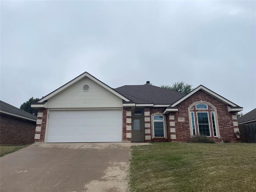 Take a look at this beautiful 3 bedroom, 2 bath, 2 car garage home in Wylie ISD. No need for a gym membership since you'll get your daily workout just by walking up the inclined driveway! NO CARPET! Wood look tile and ceramic tile throughout. ALL APPLIANCES STAY! Even the washer and dryer! Tall breakfast bar, fireplace, storage building, and a great pantry, too.