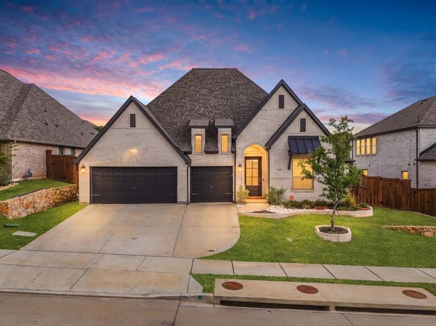 A rare Perry Homes one-story built in 2022, offering refined design, privacy, and effortless everyday living in the highly desirable Reunion community. Beautifully maintained and move-in ready, this 4-bedroom, 3.5-bath home features an open concept layout with vaulted ceilings, natural light throughout, and thoughtful finishes that enhance flow and functionality. The spacious kitchen includes an oversized island, granite countertops, stainless-steel appliances with plenty storage, ideal for both entertaining and daily living. The split bedroom floor plan provides excellent privacy, with a spa inspired primary suite offering dual vanities, a garden tub, separate glass enclosed shower and two walk-in closets. A generous flex space offers endless possibilities, perfect for a game room, home theater, playroom, or a spacious home office tailored to your lifestyle. Enjoy outdoor living on the covered patio overlooking the private backyard, plus the convenience of a 3-car garage. Located in the Reunion master planned community near US-287 with quick access to I-35W and Highway 114. Residents enjoy resort style amenities including pools, parks, trails, lakes, and outdoor gathering spaces. Zoned to Northwest ISD and perfectly positioned for daily routines and commuting.