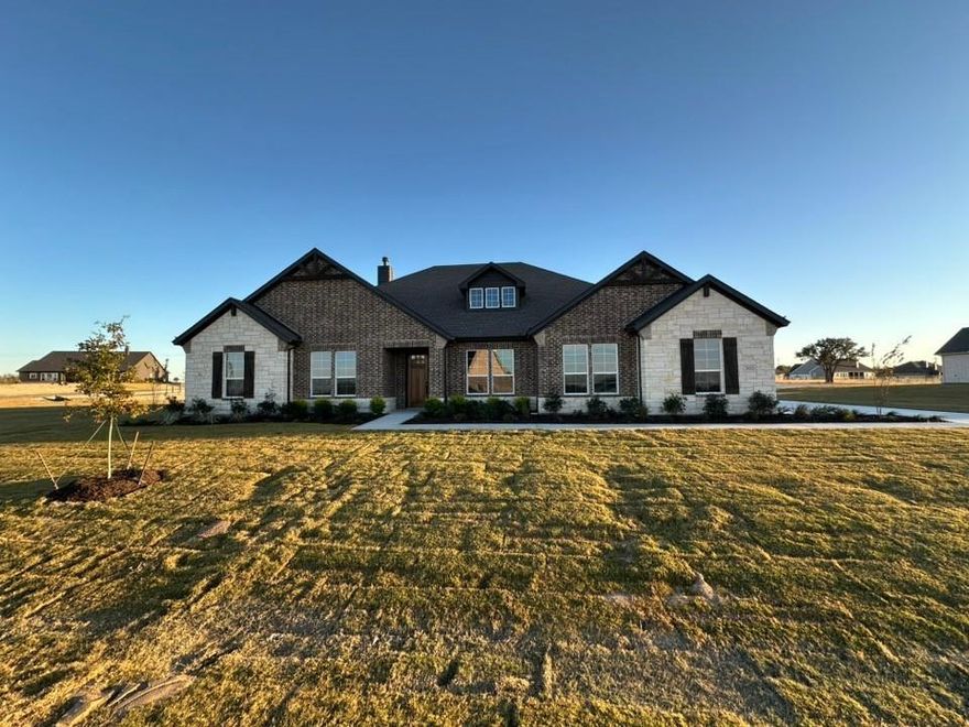 Estimated November 2025 completion! Ask us about our Trade In Trade Up program, we can buy your home! Approach the grandeur of the home through a covered porch, setting the stage for the elegance that lies within. Enter through the foyer, to the right, a versatile flex room awaits which is perfect for a cozy home office or creative space. To the left of the foyer, discover three traditional bedrooms, each accompanied by its own walk in closet and a shared full bath providing comfort and privacy for family or guests. The journey continues into the heart of the home, revealing a sprawling family room and a designer kitchen with a large island, which is an entertainer's dream. For added convenience, a game room, flex room is tucked away in the back left. On the opposite side of this ranch style home, the owner's suite beckons with a spa-like bathroom and an expansive closet, creating a private retreat that you’ll never want to leave. Next to the three car garage, a mud bench and laundry room enhance practicality, while a sizable covered back patio invites outdoor living and relaxation