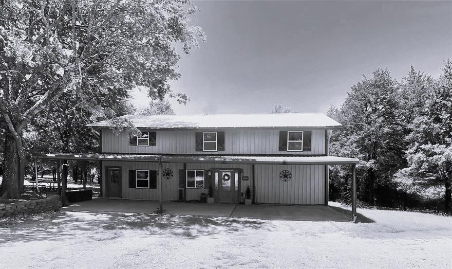 FIFTY TWO ACRES with a POND with not only one, but TWO HOMES on the property and a PRIVATE POND and a HUGE SHOP with pass through shop doors*Enjoy morning coffee by the pond, raise livestock, grow your own garden, or ride ATVs across the open fields*This property offers true Texas living at its best*Fenced and separate roads for versatility, with plenty of room to expand, build, subdivide, and ideal for multigenerational or community living*Located in a quiet, peaceful area surrounded by big beautiful trees*Just a short drive to the newly completed Bois d’Arc Lake for fishing and recreation*HOME1 is two story, each story with a complete home. Full 3-2 downstairs w kitchen dining etc, then walk upstairs to a full 3-2 home with full kitchen dining etc. Beautiful covered front porch and large covered back patio with a fantastic scenic view*SHOP has electric and plumbing and plenty of space for all the toys you would want* Circle drive for easy access* Down the hill you will find the HOME2 Barndo built in 2019 with a 2 car carport and plenty of privacy. 3-2 with OPEN CONCEPT build. Separate bedrooms. Beautiful kitchen island and decorative lighting. Primary bedroom and ensuite bathroom has additional space for a sitting area or office perhaps or whatever your heart desires but you have to come see it to believe it!